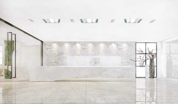 Conceptual application image of 7 of UV Can Sanitize's GALAX Surface-02 UV-C Disinfection Panel lights installed the ceiling of a hotel or office building lobby.