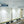 Load image into Gallery viewer, Photo of Iris Omnidirectional upper room UVGI fixture by UV Can Sanitize installed in an office boardroom.