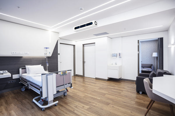 Image of Iris upper room wall-mounted UVGI fixture by UV Can Sanitize in a long-term care facility.